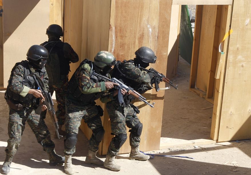 ** FILE ** In this Saturday, Jan. 9, 2010, file photo, soldiers from the anti-terrorism force of the Yemeni Defense Ministry take part in an exercise at a training camp at the Sarif district, north of the capital San'a, Yemen. U.S. special operations forces are expanding their training of the Yemeni military as the Obama administration broadens its program to counter terrorism in countries reluctant to harbor a visible American military presence. (AP Photo/Nasser Nasser, File)