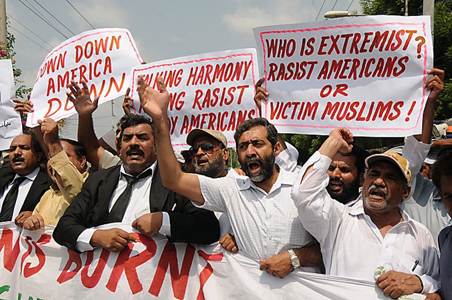Pakistani protesters rally in reaction to a small American church's plan to burn copies of the Quran in Multan, Pakistan on Thursday, Sept. 9, 2010. (AP Photo/Khalid Tanveer)