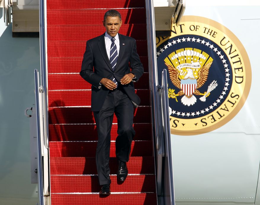 President Obama walks down the stairs from Air Force One upon his arrival at Andrews Air Force Base, Md., Wednesday, Sept. 8, 2010. (AP Photo/Jose Luis Magana)