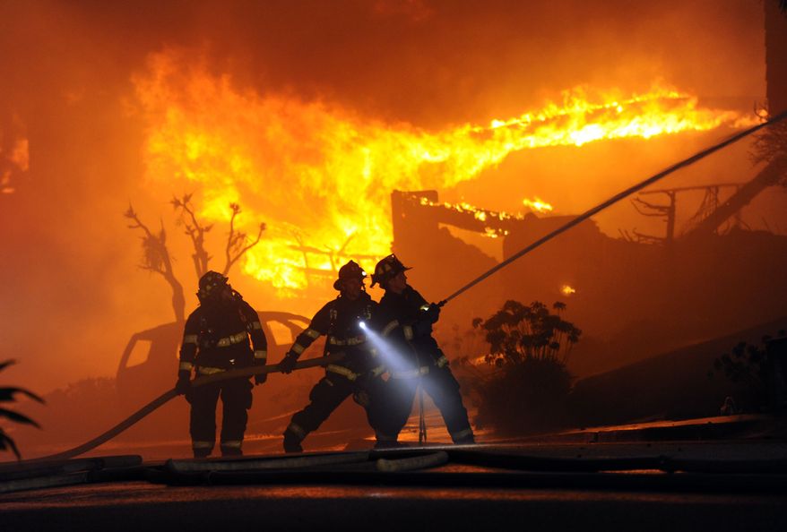 Firefighters battle a blaze possibly resulting from a high-pressure gas-line explosion in San Bruno, Calif., on Thursday, Sept. 9, 2010. (AP Photo/Bay Area News Group, Karl Mondon)