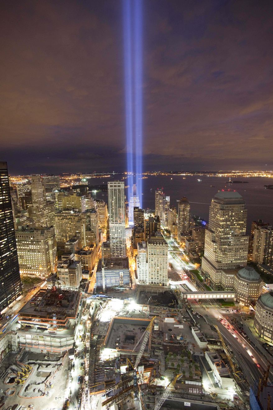 The Tribute in Light shines above the World Trade Center site, bottom, and the lower Manhattan skyline, Friday, Sept. 10, 2010, in New York. Saturday will be the ninth anniversary of the attacks on the World Trade Center. (AP Photo/Mark Lennihan)