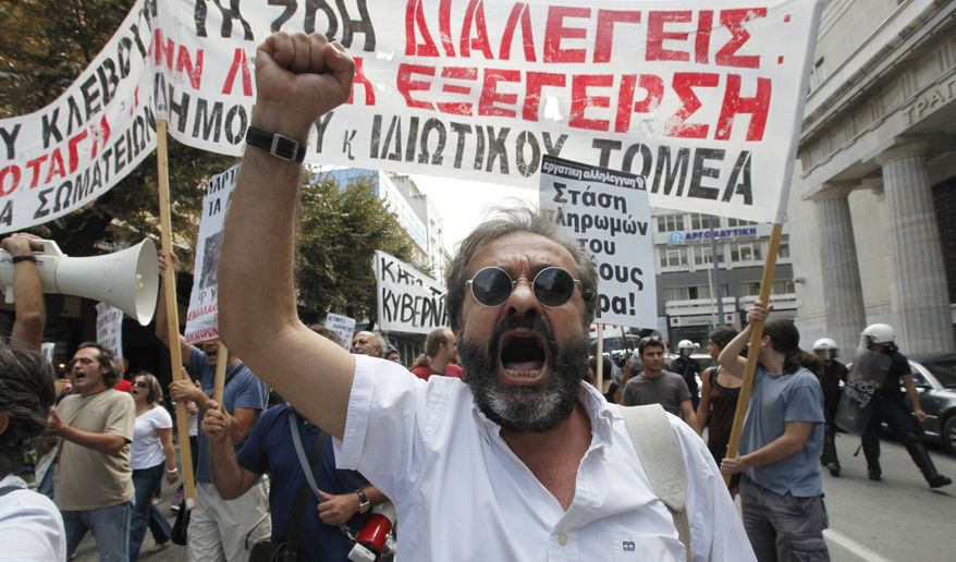 A demonstrator shouts anti-government slogans in Thessaloniki, Greece, Friday Sept. 10, 2010. Unions are staging protests in Thessaloniki ahead of an annual weekend speech on the state of the economy by Prime Minister George Papandreou. (AP Photo/Dimitri Messinis)