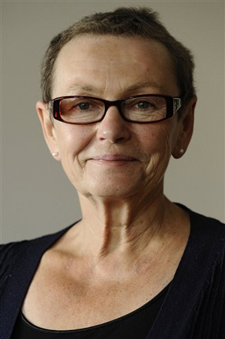 FILE - In this Sept. 1, 2009 file photo Baerbel Bohley, a prominent figure in the pro-democracy movement that helped end communist rule in the former East Germany, poses for a photograph in her apartment in Berlin, Germany. The Robert Havemann Society _ a group set up by the New Forum movement that Bohley co-founded _ said she died of cancer on Saturday, Sept. 11, 2010, at the age of 65. (AP Photo/dapd, Philipp Guelland, File)