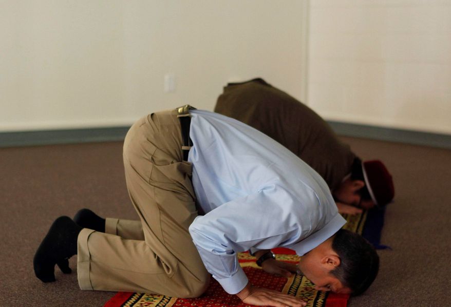 Co-founder Hatem Bazian (front) and co-founder and Chairman of the Board Shakir Yusuf pray at Zaytuna College in Berkeley, Calif. Amid the uproar over the proposed mosque near the former World Trade Center, the new Islamic college opened its doors with plans to educate a new generation of Muslim American leaders. (Associated Press)