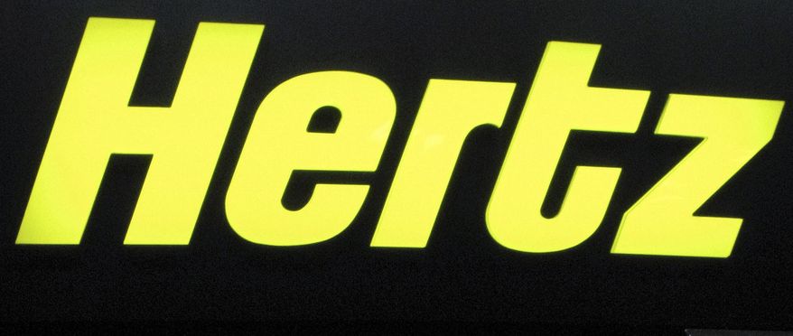 ** FILE ** The Hertz logo is pictured at the counter of a Hertz car-rental office in Cedar Rapids, Iowa, in 2008. (AP Photo/Julie Jacobson, File)