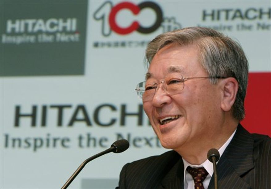 FILE - In this April 6, 2010 file photo, President of Japan's electronics maker Hitachi Hiroaki Nakanishi smiles during a press conference in Tokyo. Nakanishi has urged Monday, Sept. 13, the Japanese government to curb the strength of the yen which he says is undermining business growth prospects. (AP Photo/Shuji Kajiyama, File)