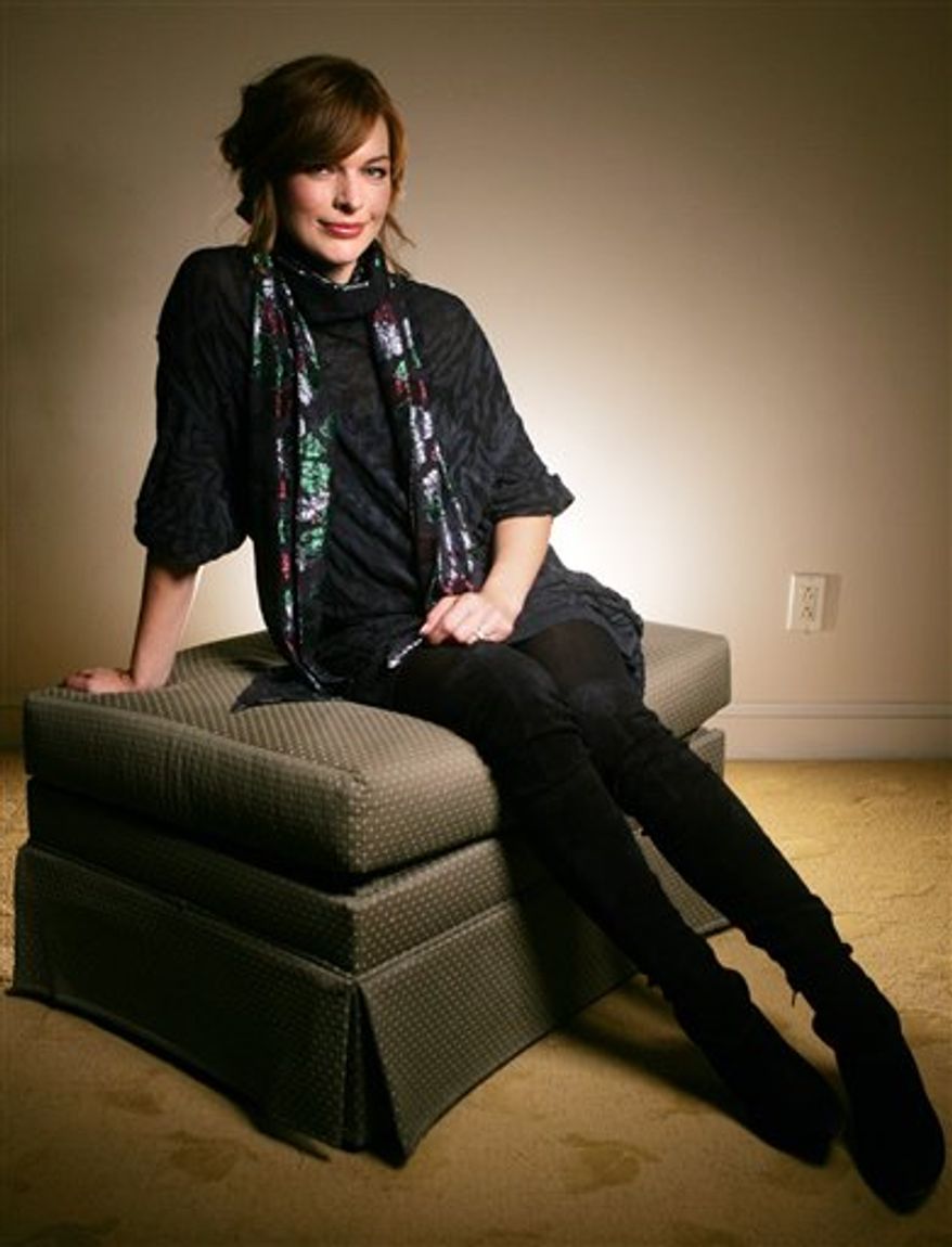 Actress Milla Jovovich of the film "Stone" poses for a portrait while promoting the film at the Toronto International Film Festival Thursday Sept. 09, 2010.   (AP Photo/Carlo Allegri)