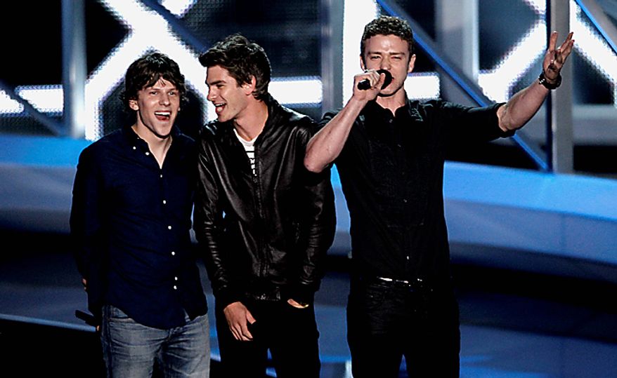 From left, Jesse Eisenberg, Andrew Garfield and Justin Timberlake are seen on stage at the MTV Video Music Awards on Sunday, Sept. 12, 2010 in Los Angeles. (AP Photo/Matt Sayles)