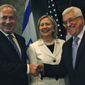 Israeli Prime Minister Benjamin Netanyahu, left, shakes hands with Palestinian Authority President Mahmoud Abbas, second right, joined by Secretary of State Hillary Rodham Clinton, center during bilateral talks at the Red Sea resort of Sharm el Sheik, Egypt Tuesday Sept. 14, 2010. (AP Photo/Nasser Nasser)