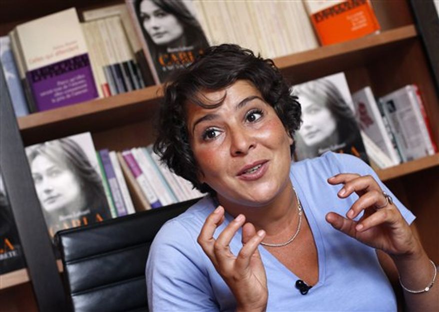 Besma Lahouri, a French journalist speaks during an interview with Associated Press as she presents her book "Carla: A Secret Life", in Paris, Tuesday, Sept. 14, 2010. The unauthorized biography of French first lady wife of French President, Carla Bruni-Sarkozy suggests that presidential aides have reined in the Italian-born heiress and ex-supermodel in a bid to transform her public image from that of a tempestuous man-eater, into a meek, model housewife. (AP Photo/Christophe Ena)