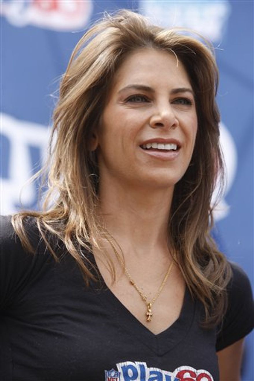 FILE - This April 21, 2010 file photo shows Jillian Michaels at a youth football clinic in New York. GoDaddy.com is adding a second spokeswoman as it closes in on $1 billion in annual sales this year: Jillian Michaels, the fitness guru that Go Daddy founder and CEO Bob Parsons calls "smokin' hot."(AP Photo/Seth Wenig, File)