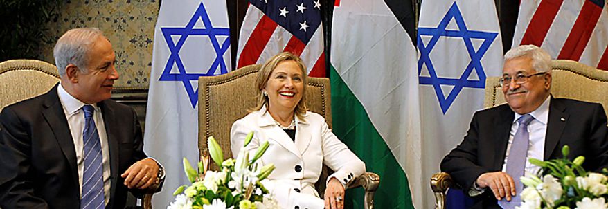 U.S. Secretary of State Hillary Rodham Clinton, center, meets with Israeli Prime Minister Benjamin Netanyahu, left, and Palestinian President Mahmoud Abbas, in Sharm El-Sheikh, Egypt, Tuesday, Sept. 14, 2010. Leaders are meeting for Mideast peace talks. (AP Photo/Alex Brandon, Pool)