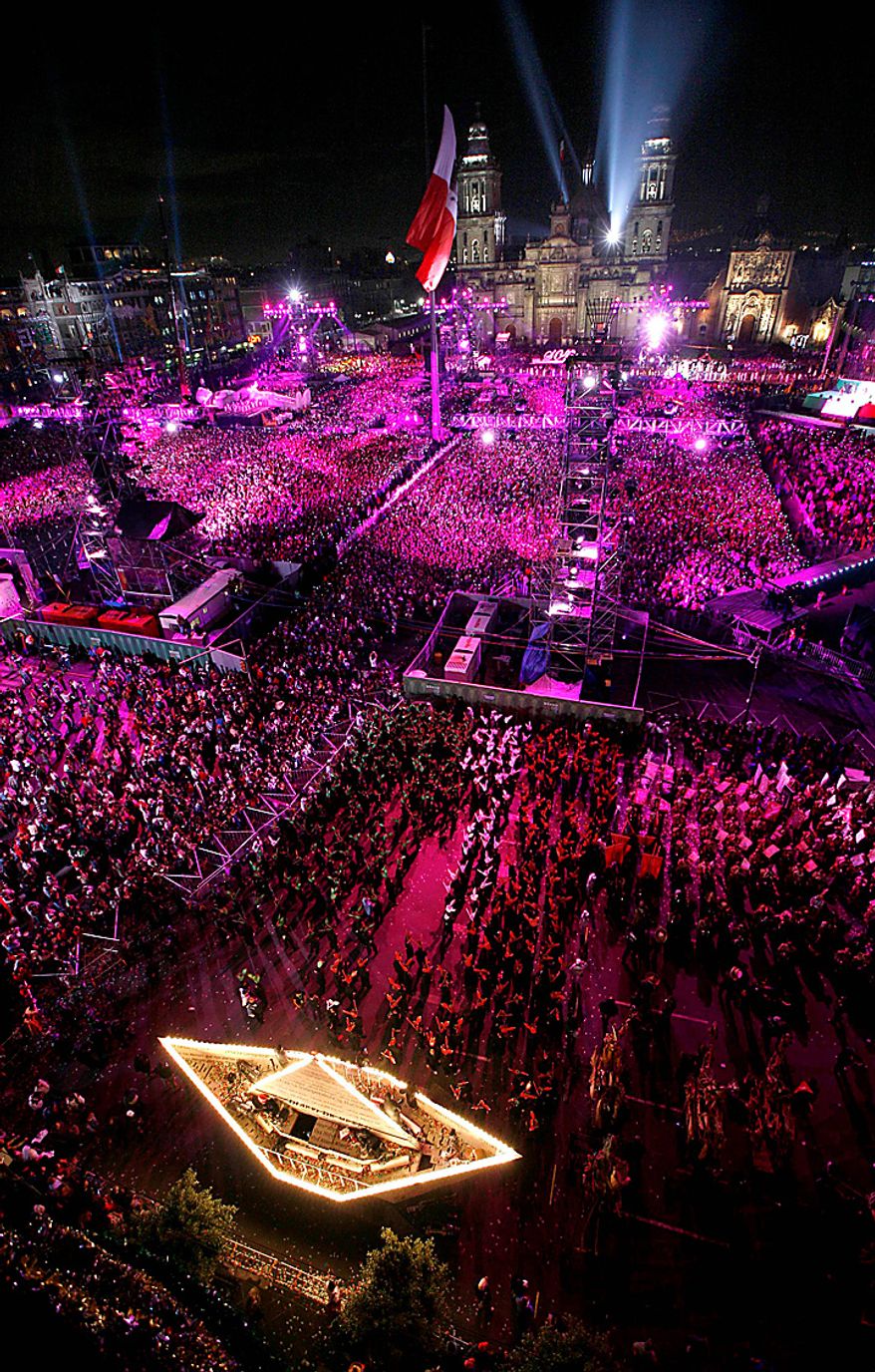 The Zocalo plaza and Metropolitan Cathedral are illuminated during bicentennial celebrations in Mexico City, Wednesday Sept. 15, 2010. Mexico celebrates the 200th anniversary of its 1810 independence uprising. (AP Photo/Marco Ugarte)