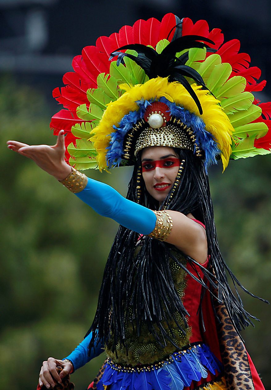A woman participates in a bicentennial parade in Mexico City, Wednesday Sept. 15, 2010. Mexico celebrates the 200th anniversary of its 1810 independence uprising. (AP Photo/Miguel Tovar)