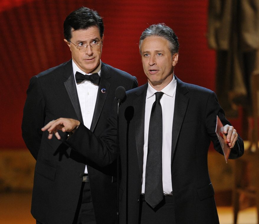 In this Sept. 21, 2008, file photo, Stephen Colbert, left, and Jon Stewart make an award presentation at the 60th Primetime Emmy Awards in Los Angeles. The Comedy Central duo plans to hold two marches on the Washington Mall on Oct. 30. (AP Photo/Mark J. Terrill, file)