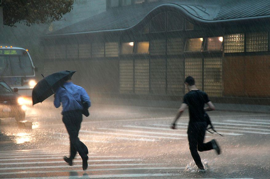 Pedestrians run along Broadway in the Upper West Side neighborhood of New York Thursday, Sept. 16, 2010 as a strong storm blasted wind and rain through the area. (AP Photo/Craig Ruttle)