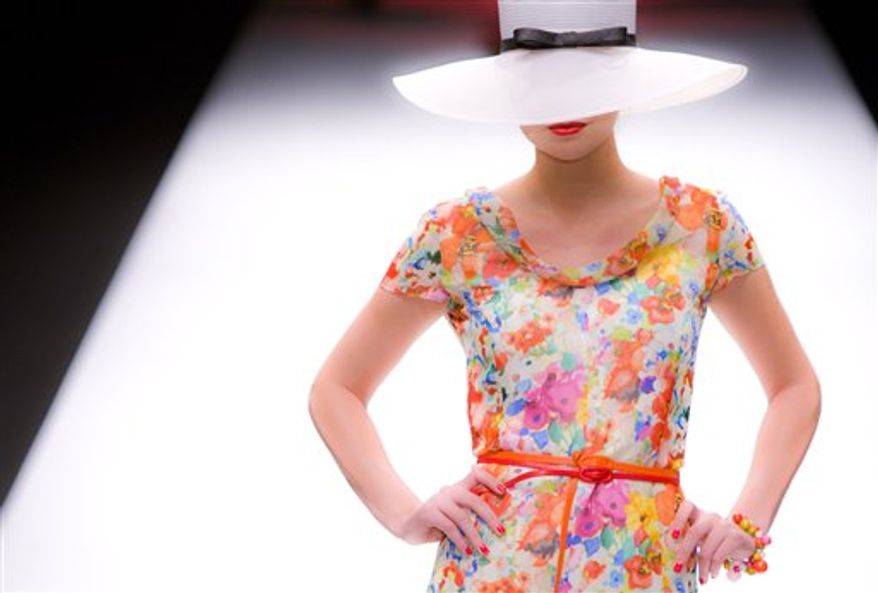 A model wears an outfit by designer Caroline Charles during her show at London Fashion Week, in London, Friday, Sept. 17, 2010. The designers are showing their Spring/Summer 2011 collections. (AP Photo/Joel Ryan)