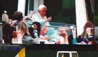 Pope Benedict XVI arrives by &quot;Popemobile&quot; for the Prayer Vigil, as seen on a large screen, at Hyde Park in London Saturday Sept. 18, 2010. (AP Photo / Chris Ison, Pool)