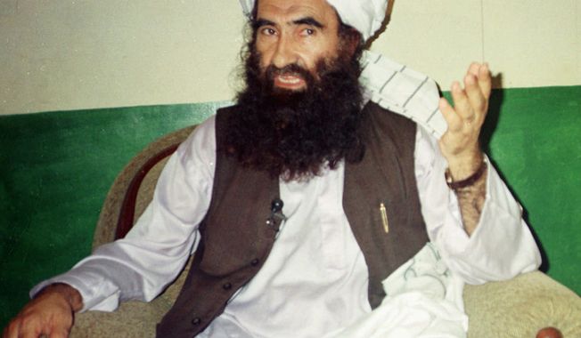 ** FILE ** Jalaluddin Haqqani, then the supreme commander of the Taliban army, talks with reporters in Miram Shah in Pakistan&#x27;s Waziristan region in 1998. (AP Photo/Mohammad Riaz, File)