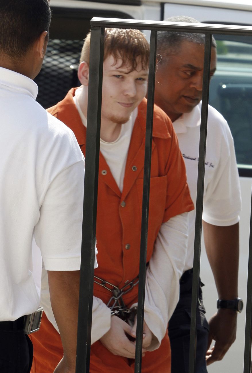** FILE ** Aspiring hard-core rapper Richard "Sam" McCroskey is led into the Prince Edward County Courthouse in Farmville, Va., for a hearing on Tuesday, June 22, 2010. (AP Photo/Steve Helber, File)