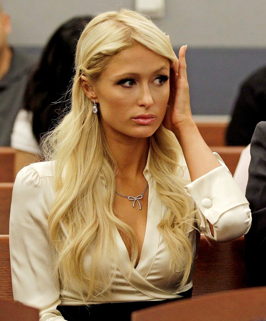 Paris Hilton waits for her hearing to start in Clark county court, Monday, Sept. 20, 2010, in Las Vegas. Hilton pleaded guilty to two misdemeanor charges stemming from her arrest last month at a Las Vegas hotel-casino. She will serve a year of probation and avoid a felony charge under the terms of a plea deal worked out with prosecutors. (AP Photo/Julie Jacobson)