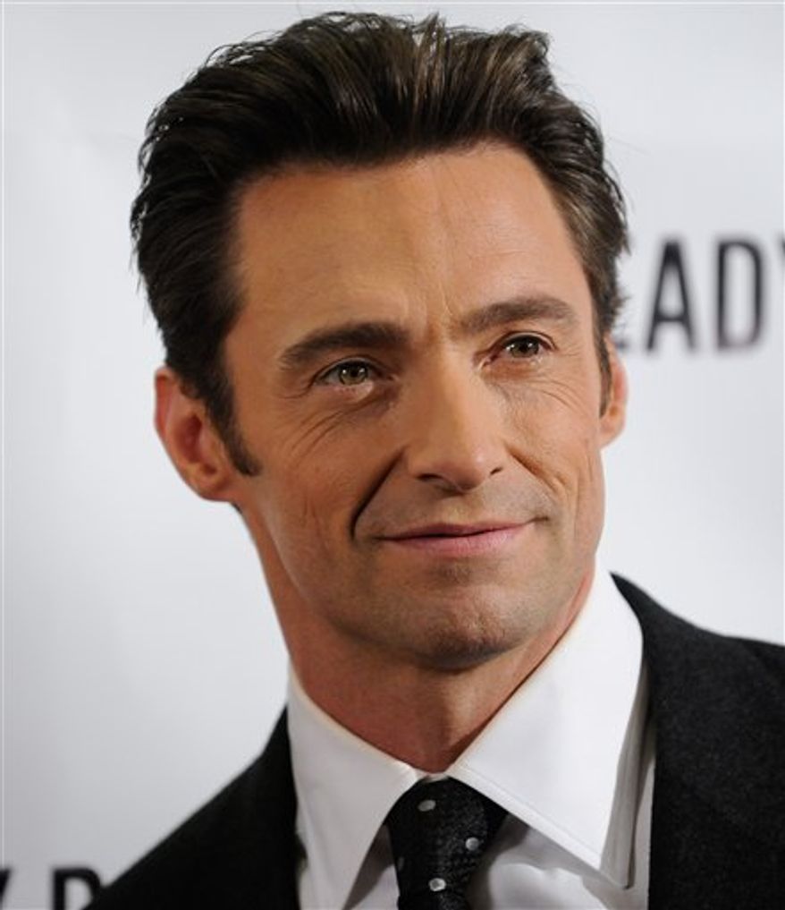 FILE - In this Sept. 29, 2009 file photo, actor Hugh Jackman poses during a photo opportunity following the Broadway opening performance of 'A Steady Rain' in New York. Authorities say a helicopter used in the filming of the Hugh Jackman movie "Real Steel" snagged a power line in Michigan, causing a brief power outage and closing a roadway. Huron County Sheriff Kelly J. Hanson tells the Huron Daily Tribune of Bad Axe that no injuries were reported after the Sunday evening accident in Huron County's Sheridan Township, about 90 miles north of Detroit. (AP Photo/Evan Agostini, File)