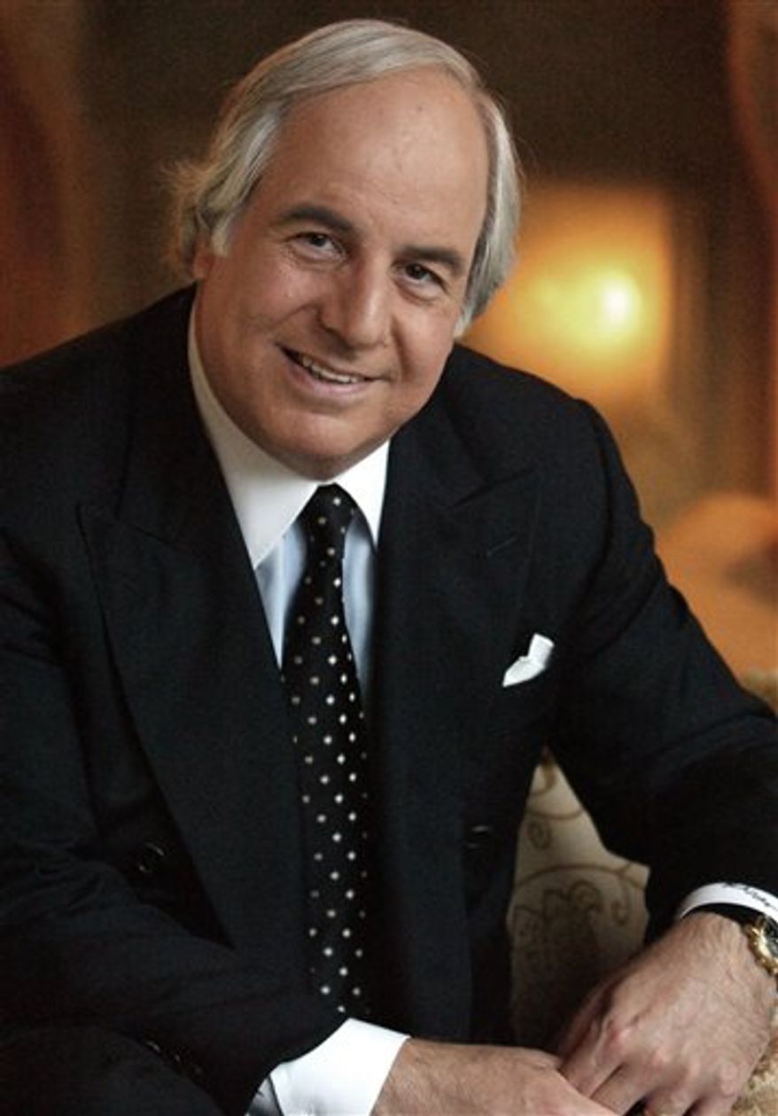 FILE - In this Dec. 16, 2002 file photo, Frank Abagnale, Jr. poses for a photo at the Four Seasons Hotel in Beverly Hills, Calif. (AP Photo/Lucy Nicholson)