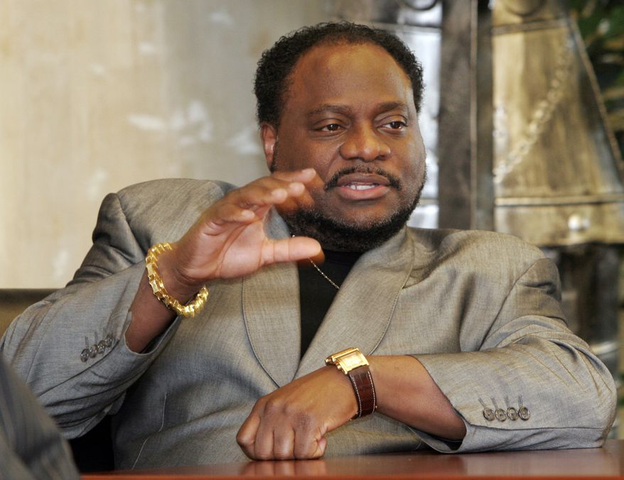 ** FILE * Bishop Eddie Long of the New Birth Missionary Baptist Church in Lithonia, Ga., gestures during an interview in 2007. On Tuesday, Sept. 21, 2010, two men filed a lawsuit accusing Bishop Long of exploiting his role as pastor of the Atlanta-area megachurch to coerce them into sexual relationships when they were members of his congregation. (AP Photo/Gene Blythe, File)