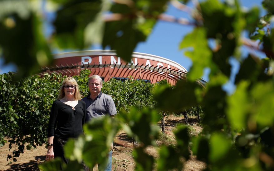 Ray and Loretta Falkner say a church's plans for a major expansion next to their Falkner Winery would ruin the view that draws brides, tourists and wine enthusiasts to them.