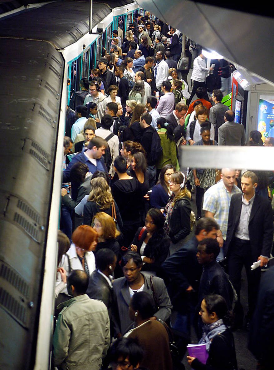 Passengers crowd a subway train Thursday, Sept. 23 2010, in Paris. Protesters are counting on people power to pressure the government to back down on its plan to up the retirement age from 60 to 62, with a second round of September strikes expected to hobble public transport, air traffic and schools across France. (AP Photo/Jacques Brinon)