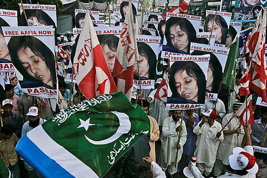 Pakistani protesters rally near the U.S. Consulate in Karachi, Pakistan, on Thursday, Sept. 23, 2010, to condemn the sentencing in New York of Aafia Siddiqui. A U.S. federal judge gave Siddiqui 86 years in prison after a jury found her guilty in February of trying to kill U.S. agents and military officers in Afghanistan in 2008. (AP Photo/Shakil Adil)
