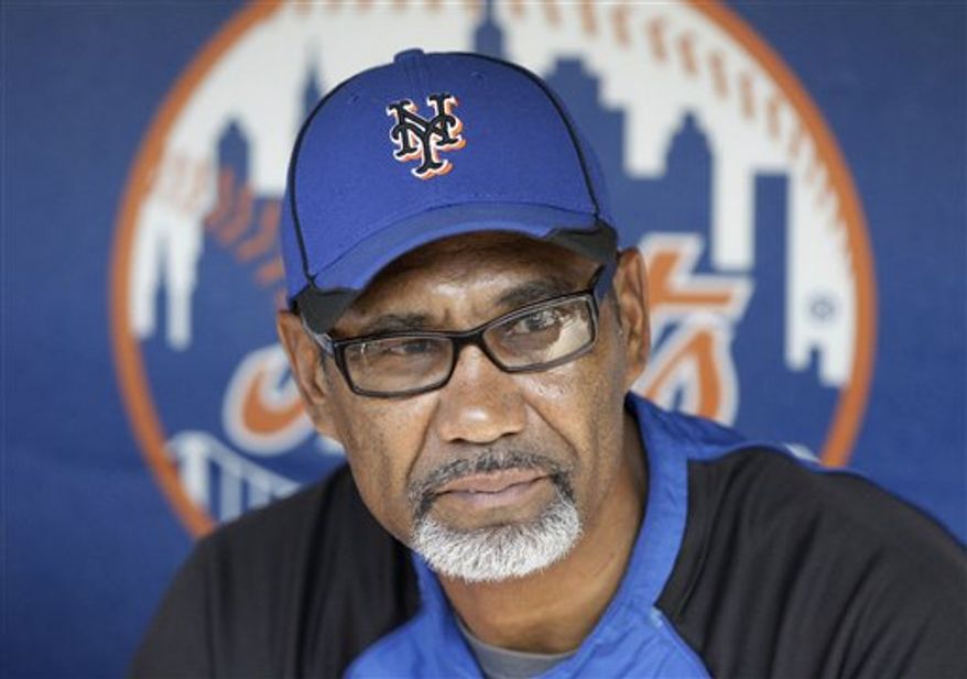 FILE - In this May 21, 2010, file photo, New York Mets manager Jerry Manuel responds to questions during a news conference before a baseball game in New York. Manuel is upset with Los Angeles Dodgers manager Joe Torre for saying he is curious about the Mets job. Manuel says he thinks it's "curious" when a person comments about a filled position. When asked if he felt Torre's comments were disrespectful because Manuel currently holds the job, Manuel replied, "Sure, no question." (AP Photo/Frank Franklin II, File)
