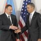 ** FILE ** In this Sept. 24, 2010, file photo, President Obama greets Azerbaijan President Ilham Aliyev during their bilateral meeting in New York. (Associated Press)