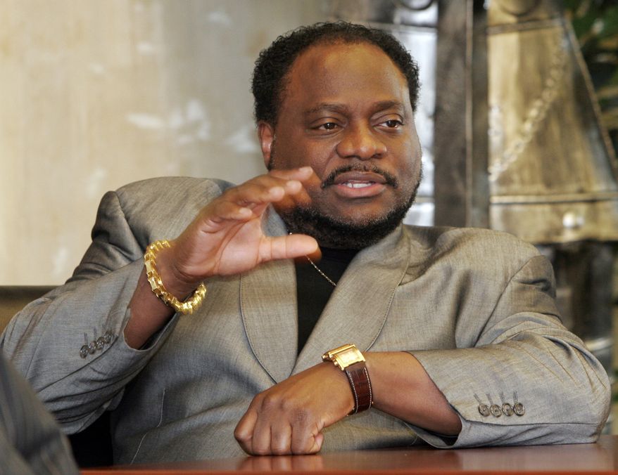 ** FILE ** In this Jan. 18, 2007, file photo, Bishop Eddie Long, of the New Birth Missionary Baptist Church, in Lithonia, Ga., gestures during an interview in Lithonia. Two men on Tuesday, Sept. 21, 2010, filed a lawsuit accusing Long of exploiting his role as pastor of an Atlanta-area megachurch to coerce them into sexual relationships when they were members of his congregation. (AP Photo/Gene Blythe, File)