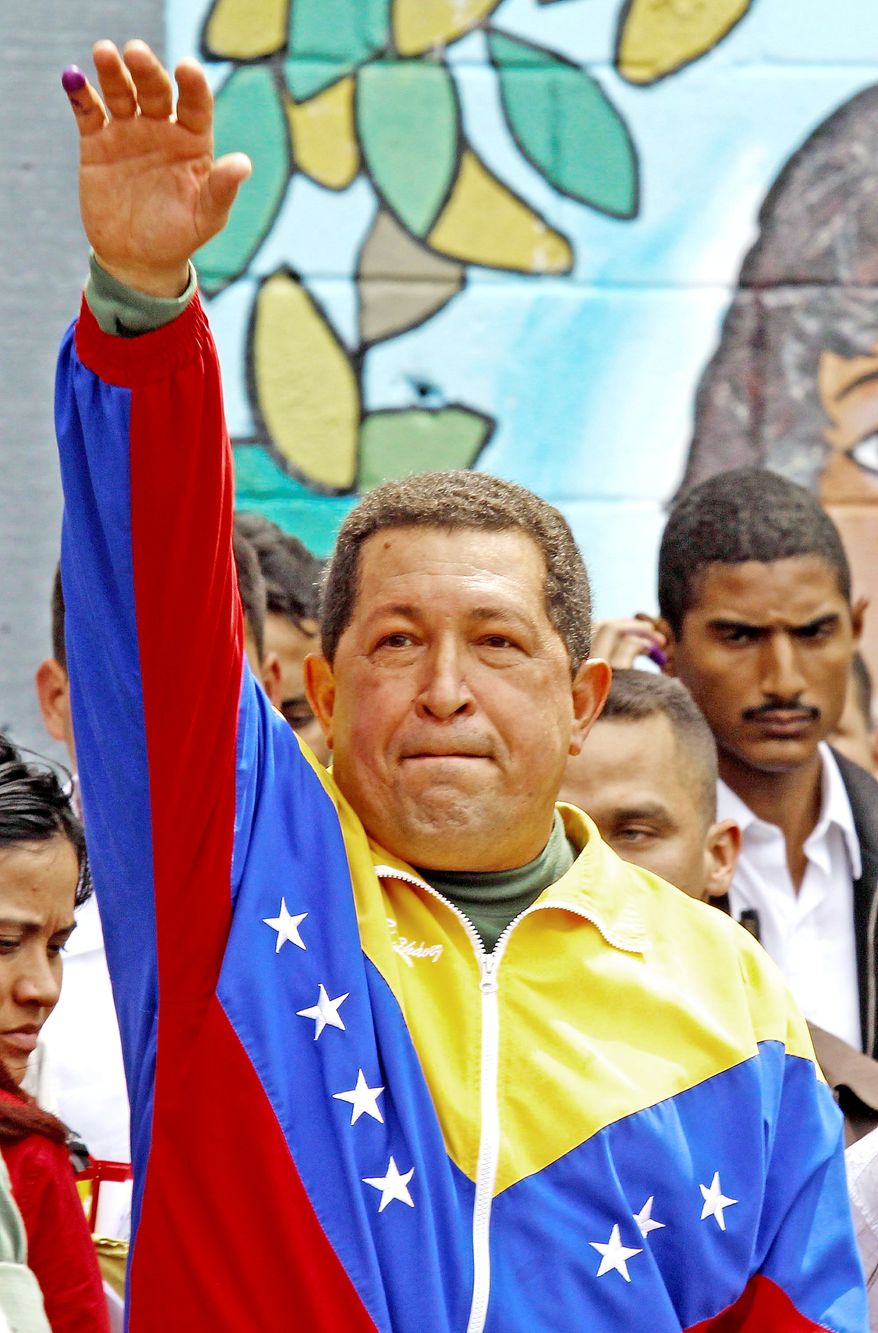 Venezuelan President Hugo Chavez greets supporters after casting his ballot. His approval rating has fallen below 50 percent as the gross domestic product shrinks and the inflation rate rises. (Associated Press)