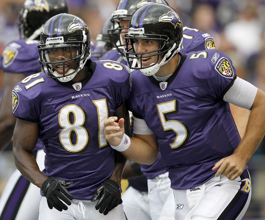 ASSOCIATED PRESS Baltimore Ravens wide receiver Anquan Boldin, left, and quarterback Joe Flacco run off the field after Boldin scored on a Flacco pass during the second half of an NFL football game in Baltimore, on Sunday, Sept. 26, 2010. The Ravens defeated the Cleveland Browns 24-17.