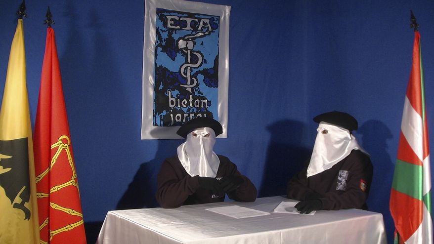 In this undated photo released by the Basque newspaper Gara on Sunday, Sept. 26, 2010, two unidentified and masked ETA members give an interview in which they say the violent, armed group is prepared to abide by such conditions as set out in March in a document called the Brussels Declaration. (AP Photo/Gara)