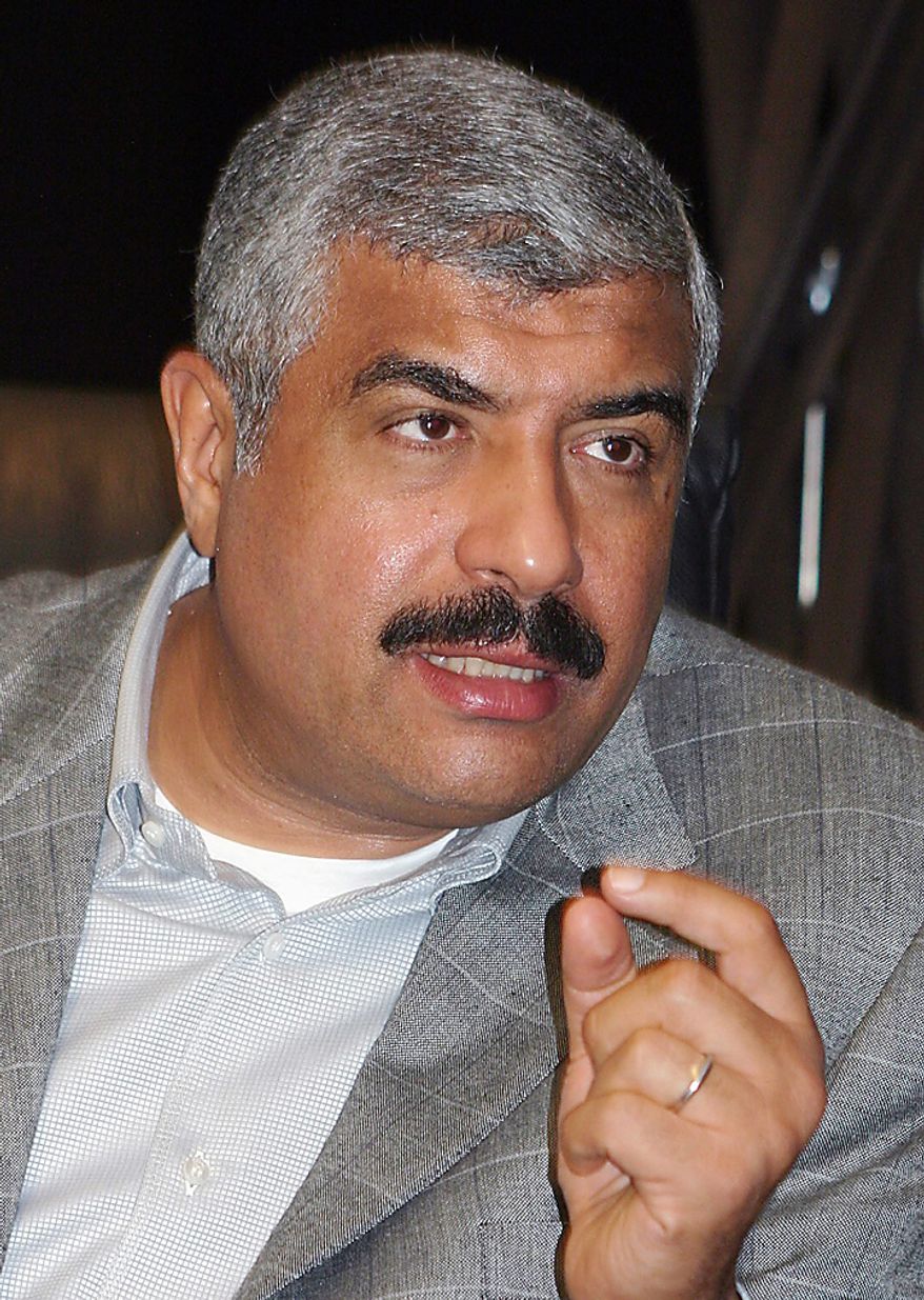 In this Sunday, Aug. 3, 2008 file photo, prominent Egyptian real estate mogul and lawmaker Hisham Talaat Moustafa talks in Cairo. In a case which has captivated the Arab public, an Egyptian court has handed billionaire tycoon Hisham Talaat Moustafa a lighter sentence of just 15 years after an earlier trial sentenced him to death for paying a retired Egyptian police officer to kill his popstar lover, Lebanese singer Suzanne Tamim. (AP Photo, File)