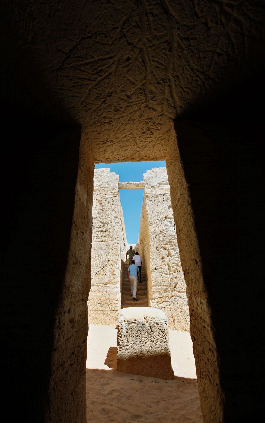 An altar is at the center of an open-air hall, part of a royal tomb at the site of ancient Leukaspis. Rich wheat and olive merchants built villas where modern Egyptians play in the sand. (Associated Press)