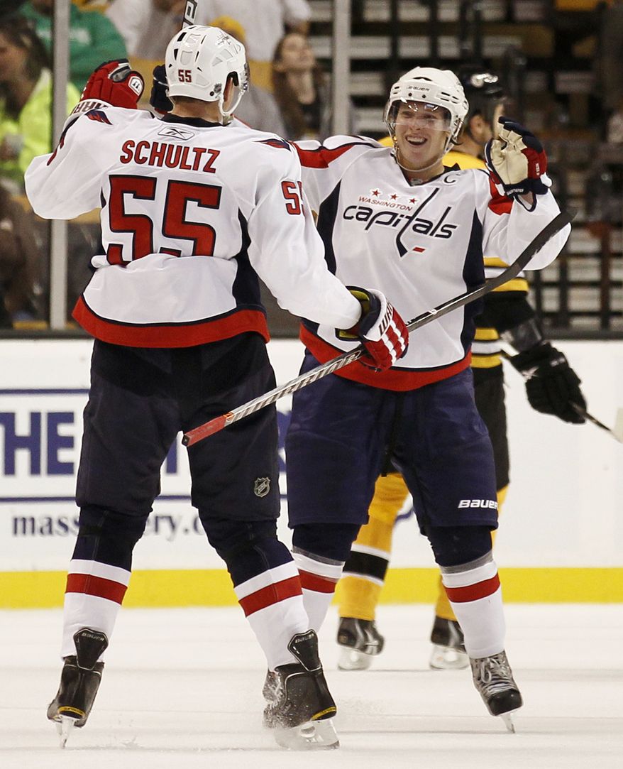 ASSOCIATED PRESS Washington Capitals' Nicklas Backstrom is congratulated by defenseman Jeff Schultz (55) after scoring against the Boston Bruins during the second period of a preseason NHL hockey game in Boston on Wednesday, Sept. 29, 2010.