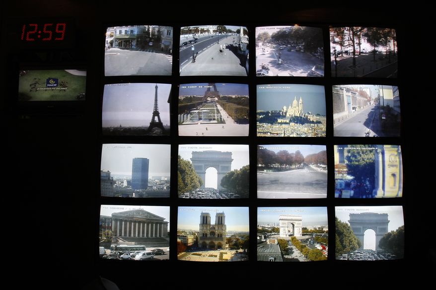 Video monitors and computer screens display various Paris sites in the underground security central command center of the Paris Prefecture on Wednesday, Sept. 22, 2010. Police say the threat of a terrorist attack on French soil is at its highest as authorities suspect al Qaeda's North African affiliate may be plotting a conventional bomb attack on a crowded target. (AP Photo/Francois Mori)