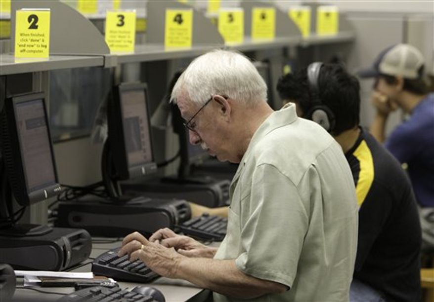 Library patrons work on the computers at the Grandview Heights Public Library Wednesday, Sept. 1, 2010, in Grandview Heights, Ohio. (AP Photo/Jay LaPrete)
