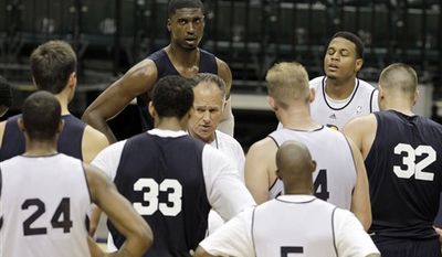 Indiana Pacers head coach Jim O'Brien talks to the team following a NBA team practice in Indianapolis, Tuesday, Sept. 28, 2010. (AP Photo/Darron Cummings)