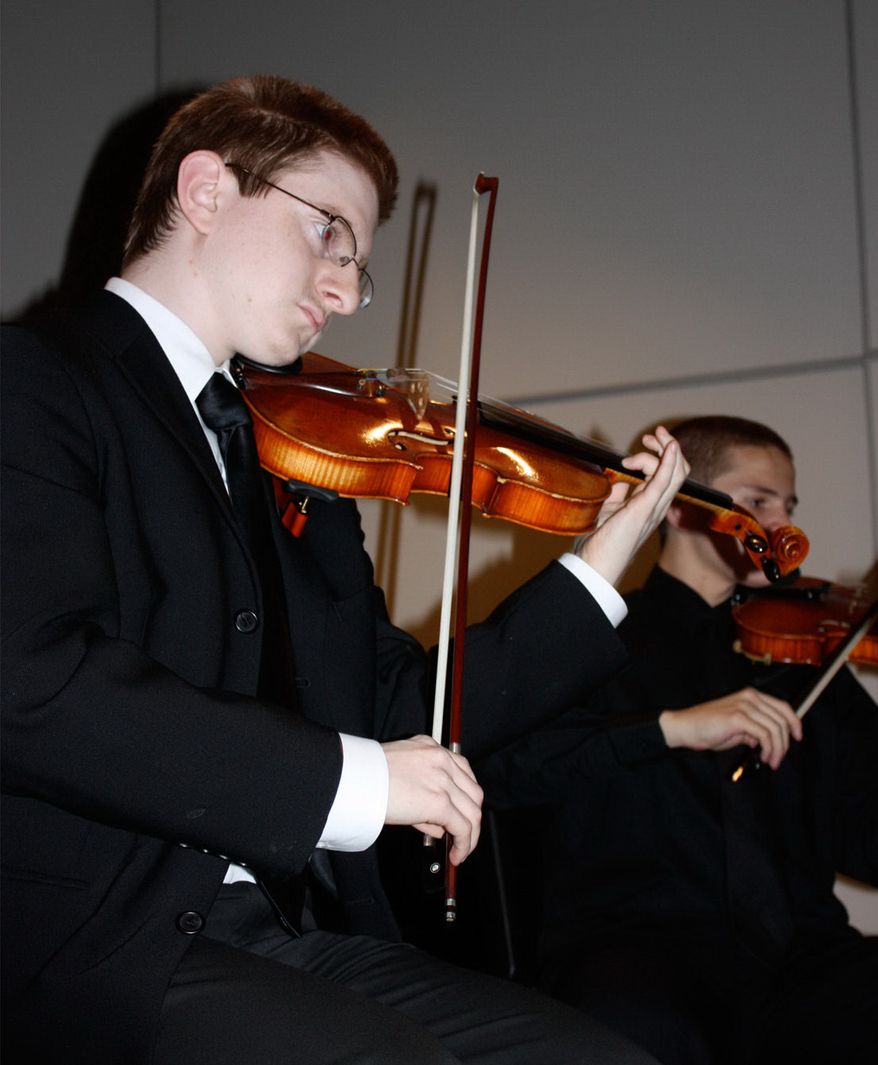Tyler Clementi plays with the Ridgewood High School Orchestra at a benefit dinner in 2009. (AP Photo/The Record of Bergen County, Ryan Pifher)