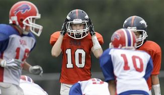 In this photo made Saturday, Sept. 25, 2010, Reed Hoelscher (10) lines up on defense during a 6th grade youth football game in Richardson, Texas.  Hoelscher and some teammates play with a new type of football helmet designed to reduce the risk of concussions. (AP Photo/LM Otero)