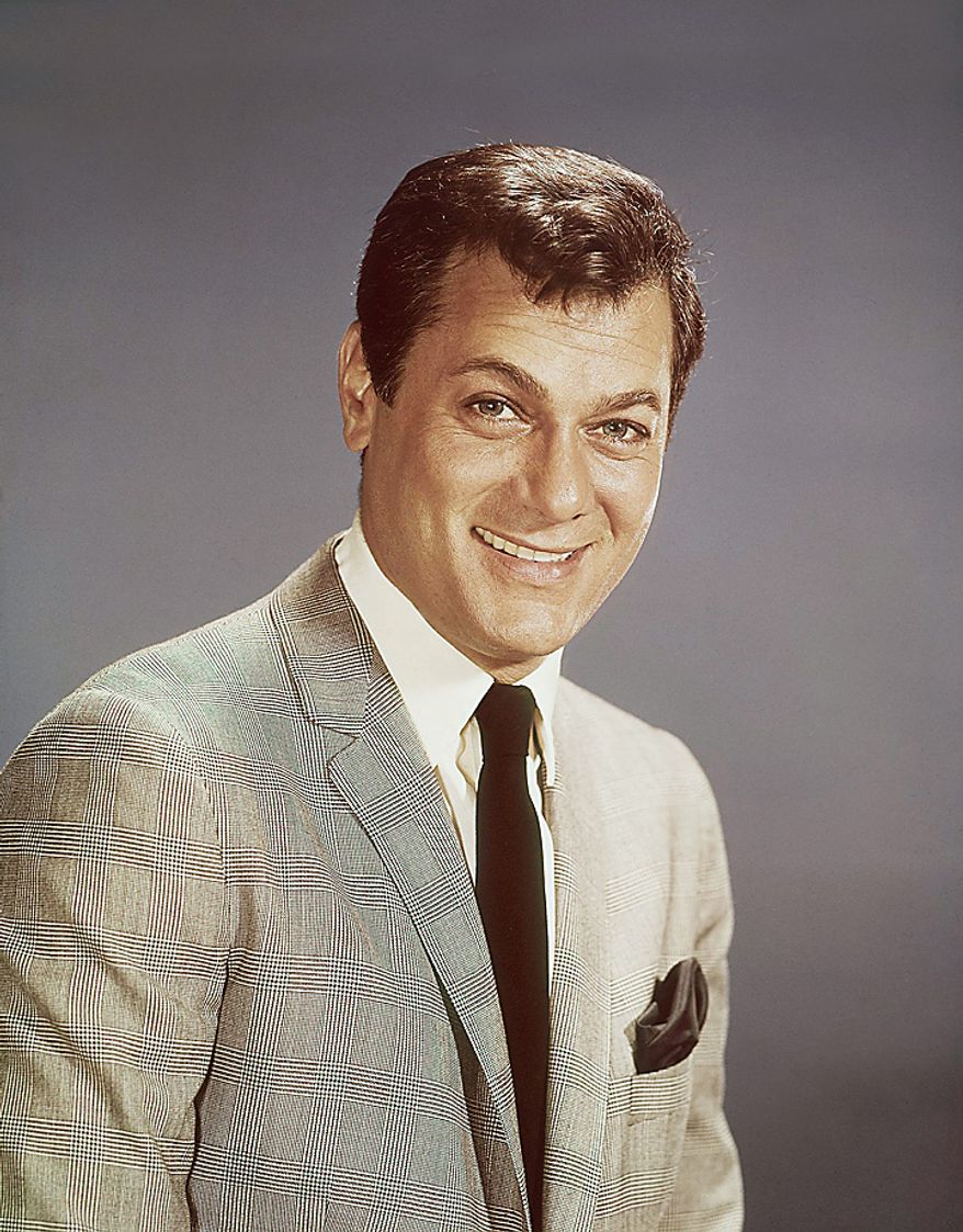 Actor Tony Curtis is shown in this 1965 file photo. Curtis, whose real name was Bernard Schwartz, was perhaps most known for his comedic turn in Billy Wilder's 'Some Like It Hot' with co-stars Marilyn Monroe and Jack Lemmon has died at 85 according to the Clark County, Nev. coroner. (AP Photo, File)
