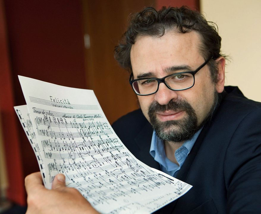 Francesco Lotoro displays sheet music written by Holocaust victims. He has collected 4,000 musical compositions written in Nazi concentration camps. (Associated Press)