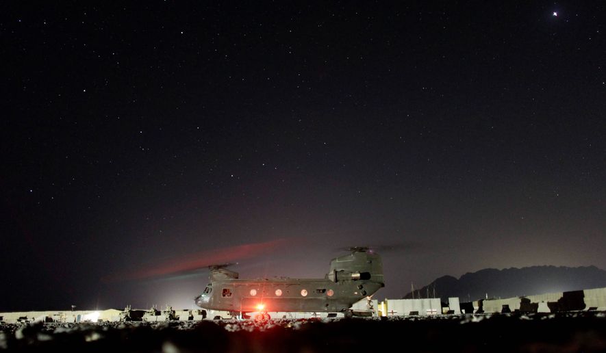 A U.S. Army helicopter prepares to leave a forward operating base in Afghanistan. Republican lawmakers say there are not enough troops to man a counter-rocket, -artillery and -mortar battery used effectively by soldiers in Iraq to intercept enemy rounds headed for forward operating bases. (Associated Press)