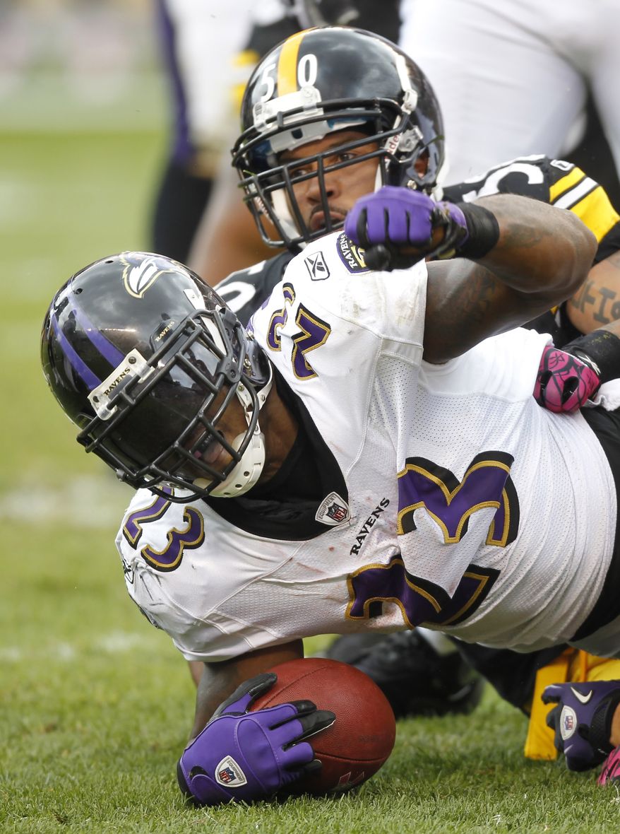 ASSOCIATED PRESS Baltimore Ravens  running back Willis McGahee (23) celebrates making a first down near the goal line in front of Pittsburgh Steelers linebacker Larry Foote (50) in the second quarter of the NFL football game in Pittsburgh, Sunday, Oct. 3, 2010. 
