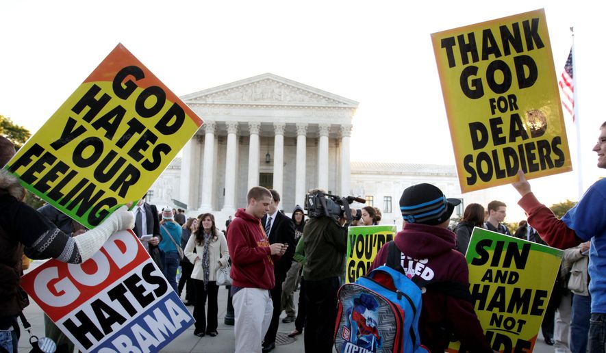 Members of the Westboro Baptist Church picket in front of the U.S. Supreme Court in Washington on Wednesday, Oct. 6, 2010. The court was hearing the free-speech dispute between Albert Snyder of York, Pa., and the Topeka, Kan., church. The case focuses on whether the church has the right to protest at funerals. (Associated Press) ** FILE **